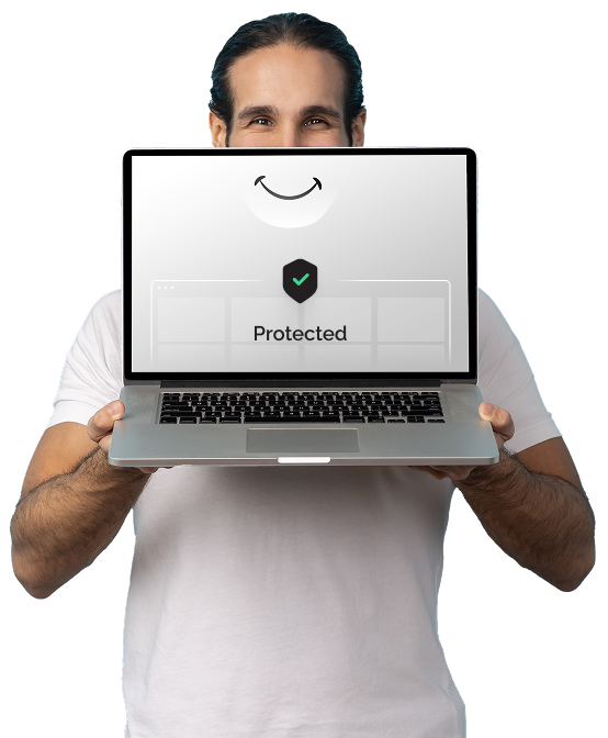 A man is standing up and looking at the camera. He is holding a laptop in front of his face with a cartoon smile on the screen approximately where his real smile would be. It says, “Ad Free Experience” on it.