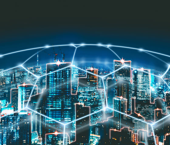 A cybernetic cityscape protected by a dome made of hexagonal panels.